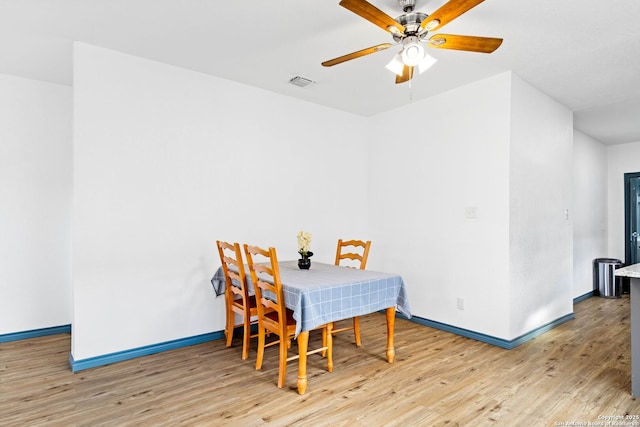 dining room featuring ceiling fan and light hardwood / wood-style flooring