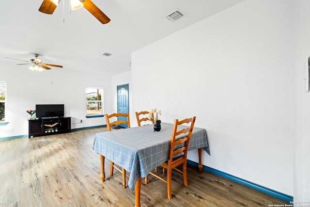 dining room with hardwood / wood-style flooring