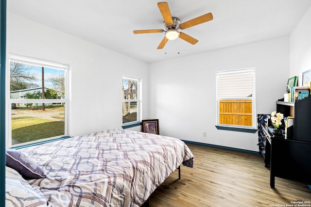 bedroom featuring ceiling fan and light hardwood / wood-style floors