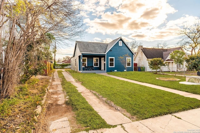 bungalow with a front yard