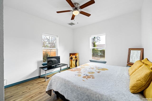 bedroom featuring ceiling fan and wood-type flooring