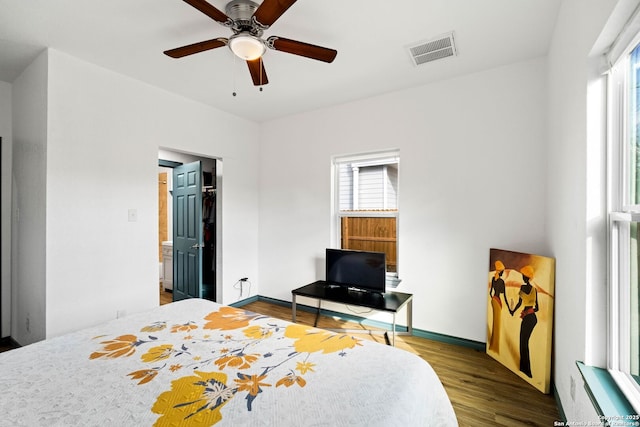 bedroom with hardwood / wood-style flooring and ceiling fan