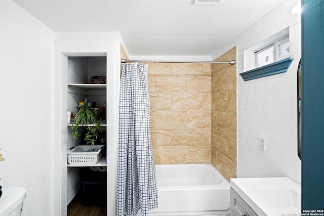 full bathroom with toilet, vanity, and shower / bath combo with shower curtain