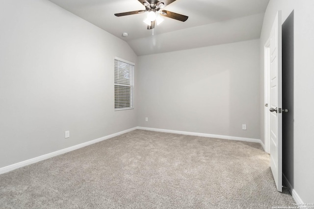 unfurnished room with ceiling fan, lofted ceiling, and carpet