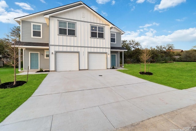 front of property with a front lawn and a garage