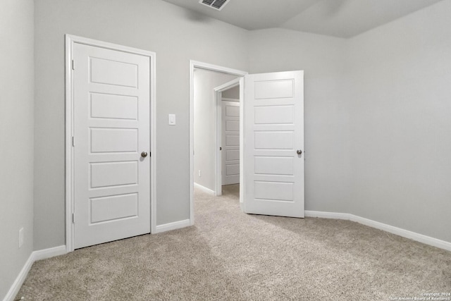 unfurnished bedroom with light carpet