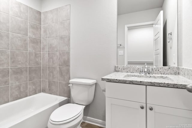 full bathroom featuring shower / bathtub combination, vanity, and toilet