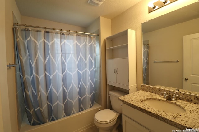 full bathroom featuring shower / bath combo with shower curtain, vanity, and toilet