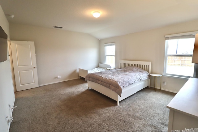 carpeted bedroom with vaulted ceiling