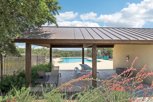 view of patio with a gazebo and a fenced in pool