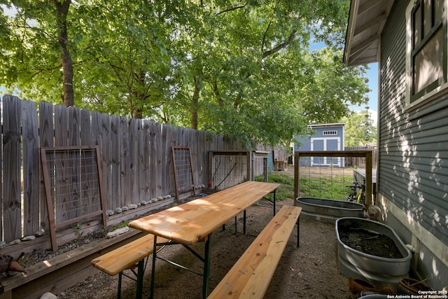 view of patio / terrace with a storage unit