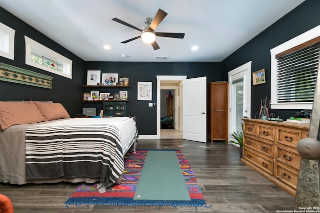 bedroom with dark wood-type flooring and ceiling fan