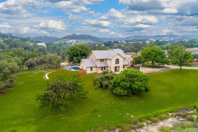 birds eye view of property featuring a mountain view