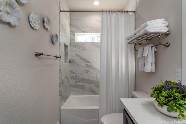 full bathroom featuring toilet, shower / bath combination with curtain, and vanity