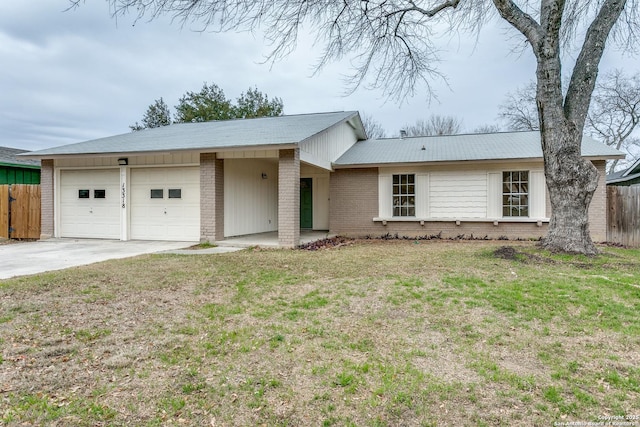 single story home featuring a front yard and a garage