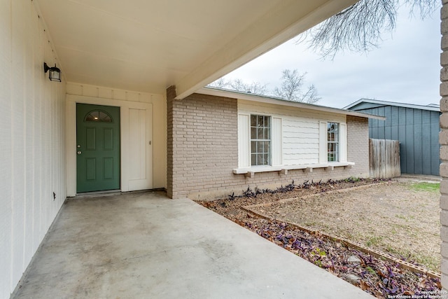 doorway to property with a patio area