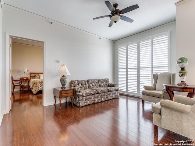 living room with ceiling fan and dark wood-type flooring