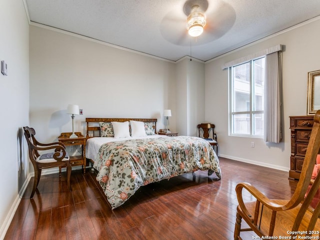 bedroom with a textured ceiling, ceiling fan, crown molding, and dark hardwood / wood-style flooring