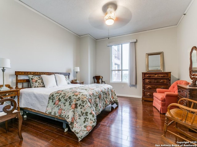 bedroom with ornamental molding, dark wood-type flooring, and ceiling fan