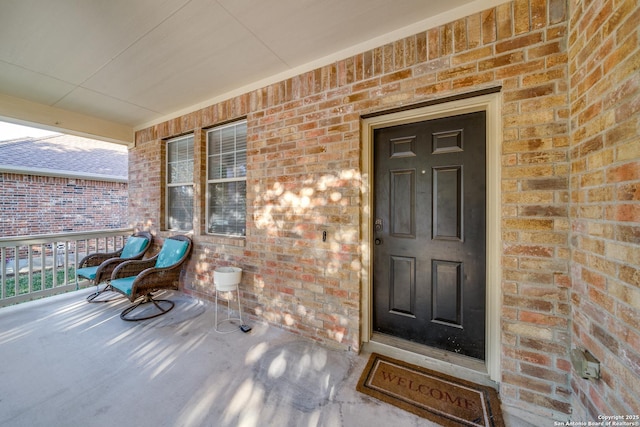 view of exterior entry featuring a porch