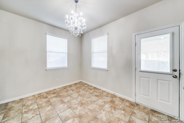 interior space featuring light tile patterned flooring and a notable chandelier