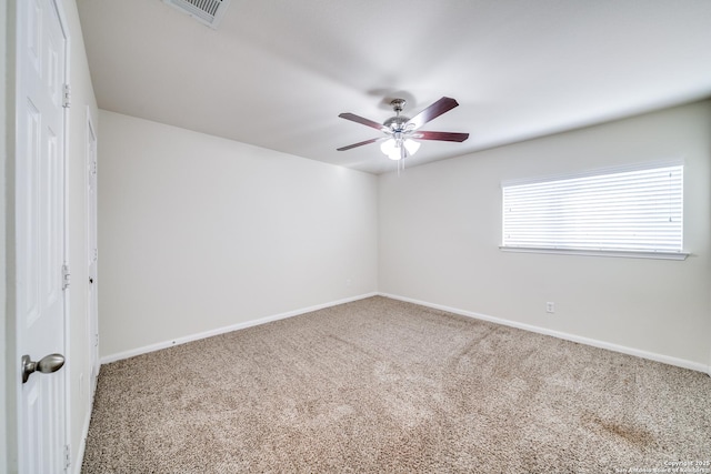 carpeted empty room with ceiling fan