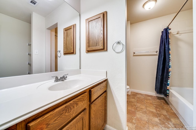 full bathroom with shower / bath combination with curtain, vanity, and toilet