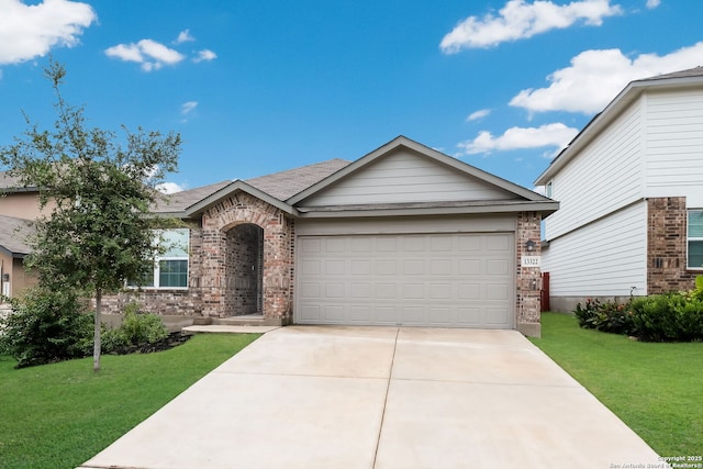 view of front facade with a front yard and a garage