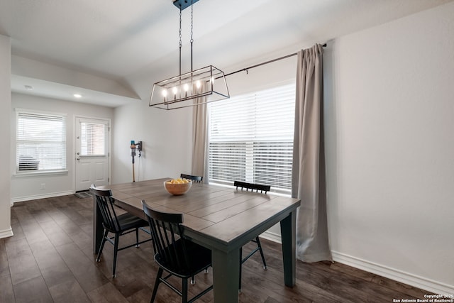 dining space with dark wood-type flooring