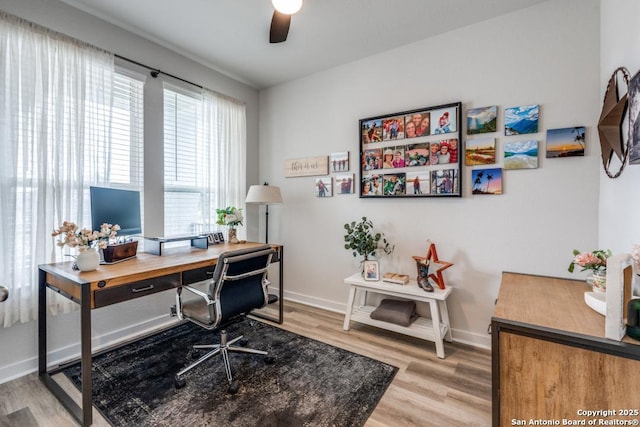 office area featuring light hardwood / wood-style floors and ceiling fan