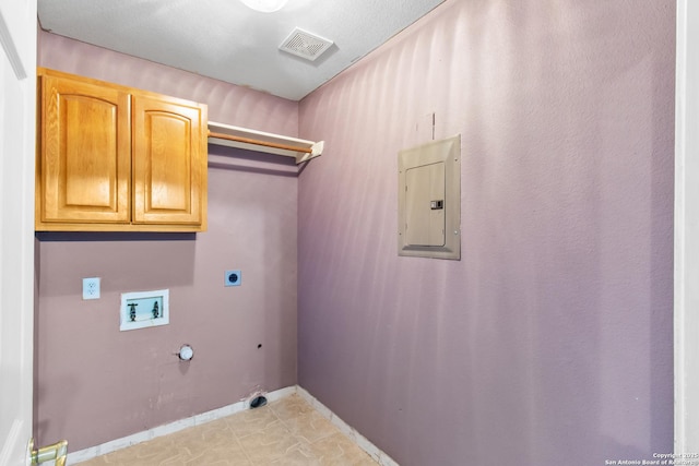 laundry room with cabinets, hookup for an electric dryer, electric panel, washer hookup, and gas dryer hookup