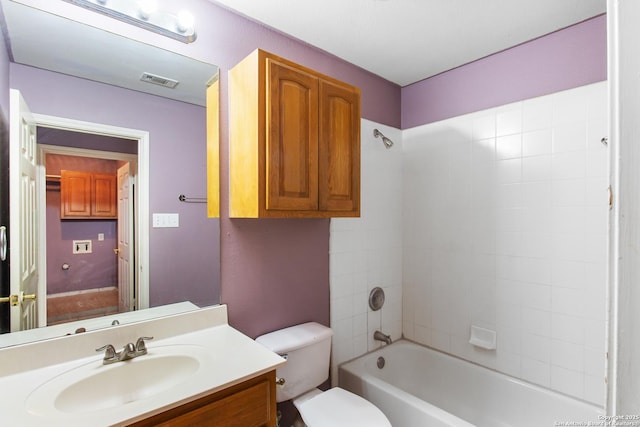 full bathroom featuring toilet, vanity, and shower / tub combination