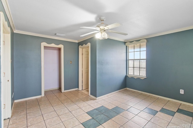 tiled spare room with ceiling fan and crown molding