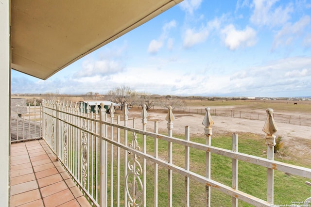 balcony featuring a rural view