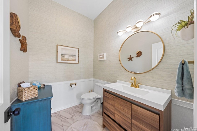 bathroom with toilet and vanity