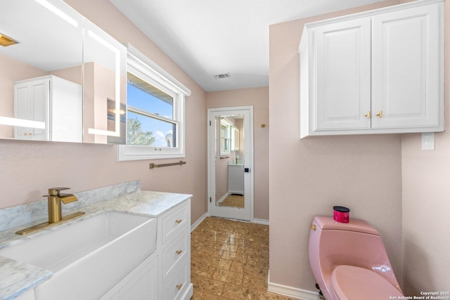 bathroom with vanity and toilet