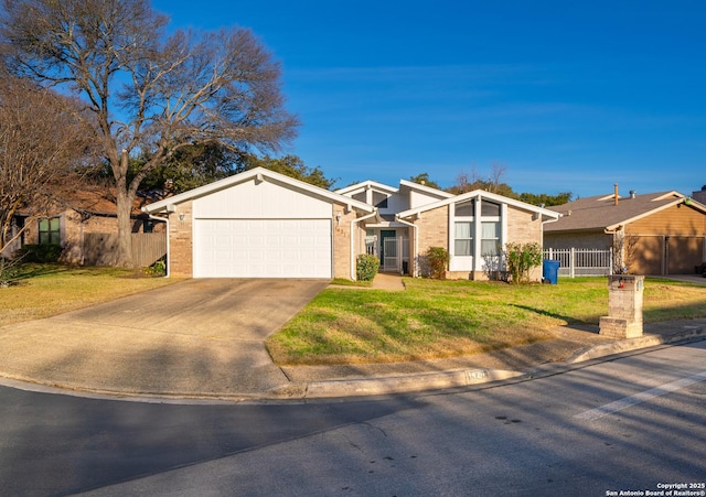 ranch-style house with a front lawn and a garage