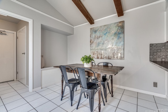 tiled dining room with vaulted ceiling with beams