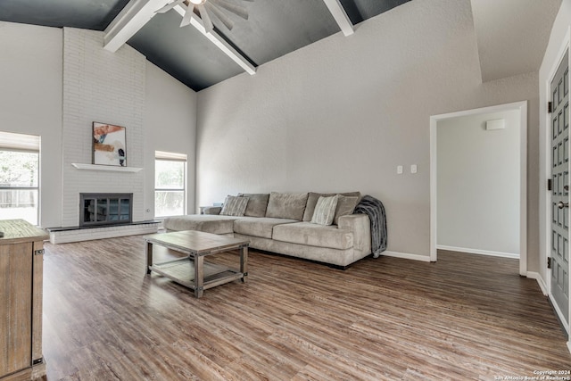 living room featuring beam ceiling, ceiling fan, high vaulted ceiling, and wood-type flooring