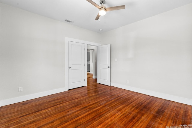 unfurnished bedroom featuring hardwood / wood-style floors and ceiling fan