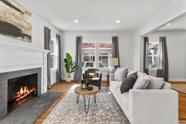 living room featuring a fireplace and hardwood / wood-style floors