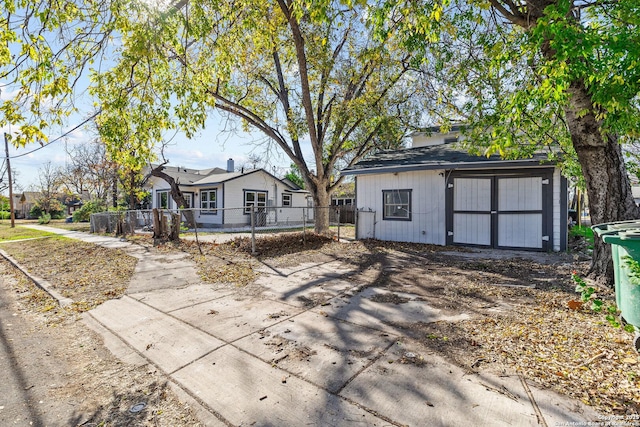 back of property with a shed