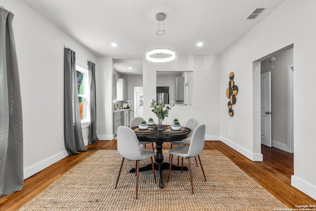 dining room with hardwood / wood-style floors