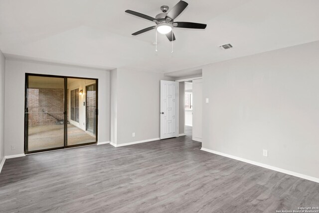 empty room featuring ceiling fan and wood-type flooring