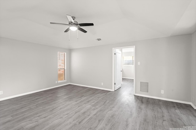 spare room with ceiling fan and dark wood-type flooring