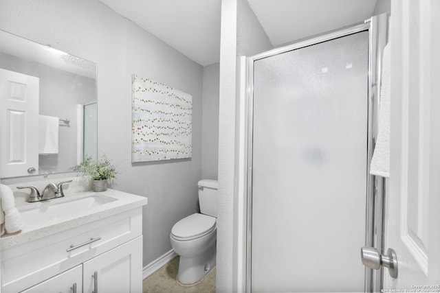 full bath with a stall shower, baseboards, vanity, and toilet