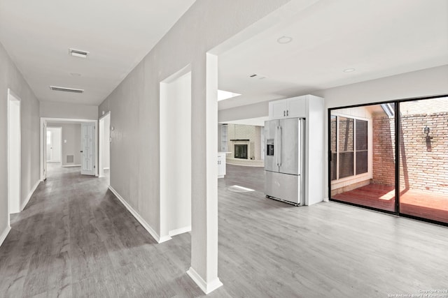 hallway with light wood-type flooring