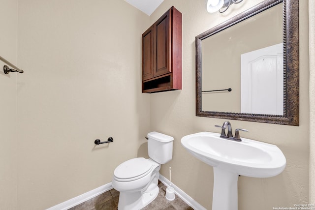 bathroom with tile patterned floors and toilet