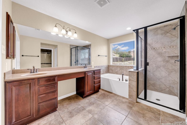 bathroom with tile patterned flooring, vanity, and shower with separate bathtub