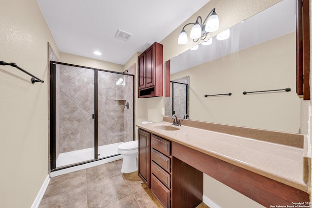 bathroom featuring tile patterned floors, an enclosed shower, vanity, and toilet